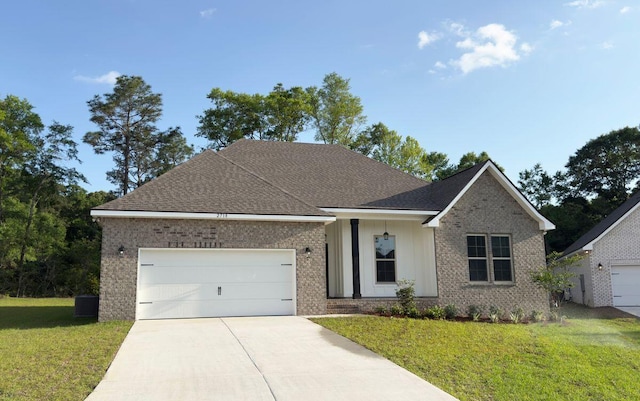 2718 Louis Cir, Crestview, FL 32536 - single story home featuring a garage, a front lawn, brick siding, and driveway
