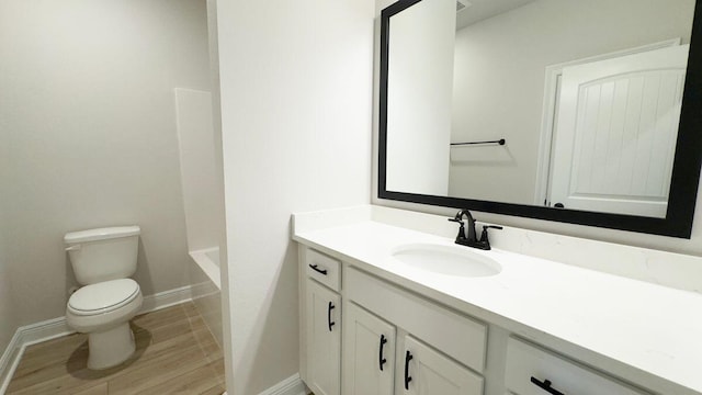 2718 Louis Cir, Crestview, FL 32536 - bathroom featuring a bathtub, toilet, baseboards, vanity, and a shower