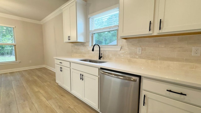 2718 Louis Cir, Crestview, FL 32536 - kitchen with a sink, dishwasher, crown molding, light countertops, and baseboards