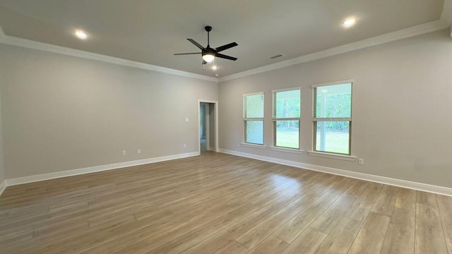 2718 Louis Cir, Crestview, FL 32536 - spare room with visible vents, crown molding, light wood finished floors, a ceiling fan, and baseboards