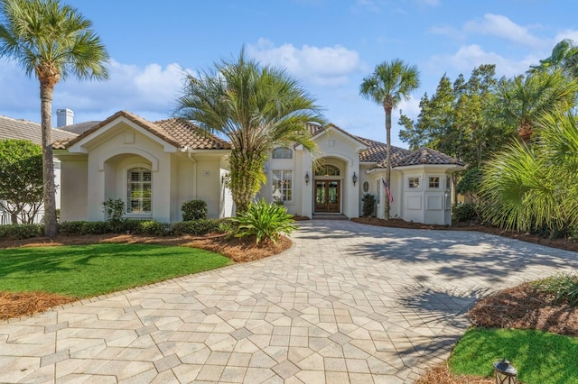 mediterranean / spanish-style house with french doors