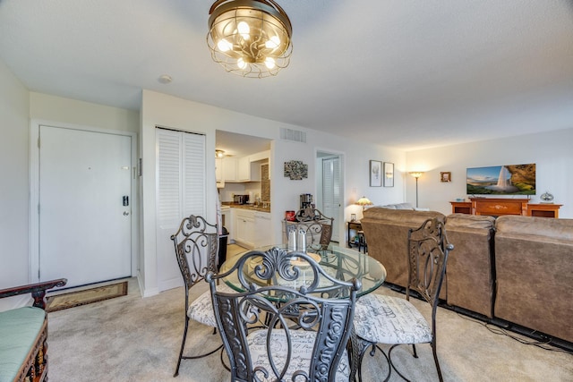 dining area with light carpet