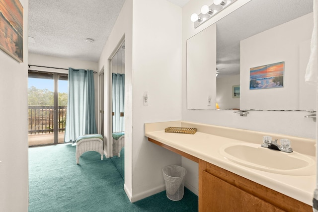 bathroom featuring vanity and a textured ceiling