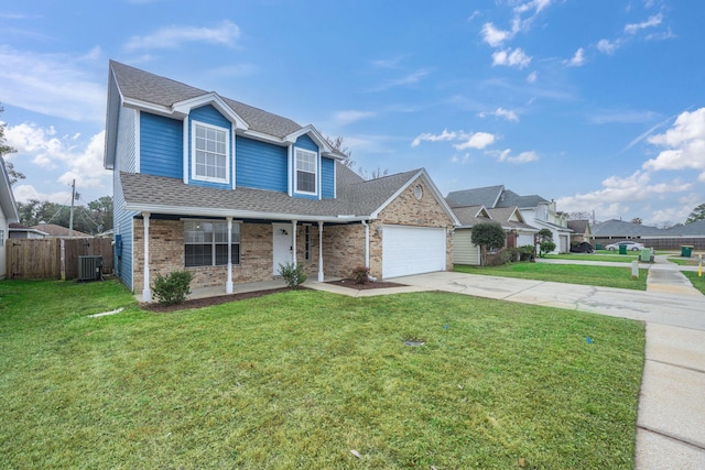 front of property featuring cooling unit, a garage, and a front yard