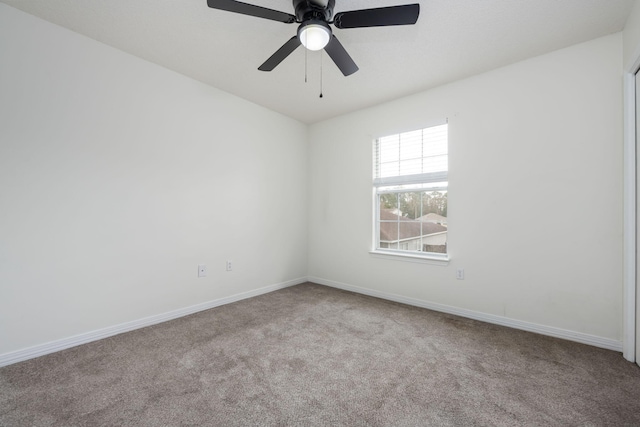 spare room with light carpet and ceiling fan