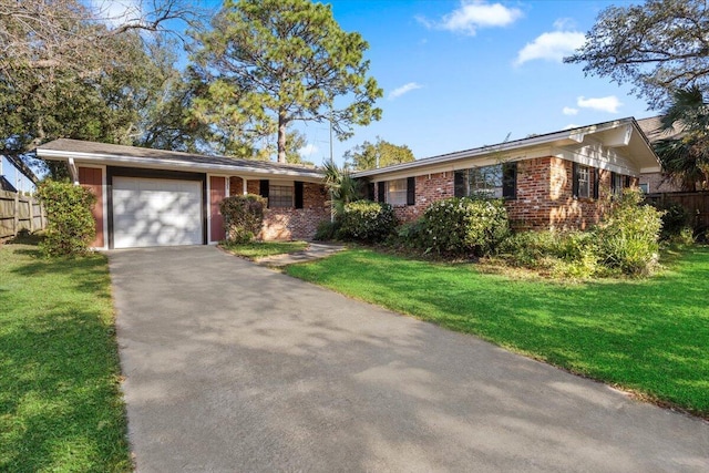 ranch-style home featuring a front lawn and a garage