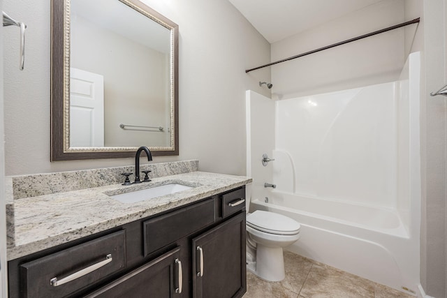 full bathroom featuring tile patterned flooring, vanity, shower / bathtub combination, and toilet