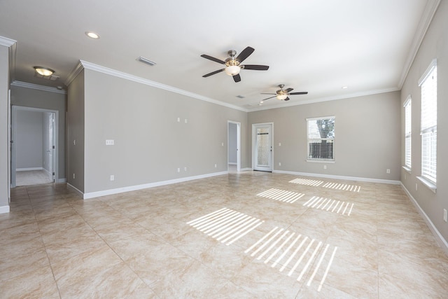 empty room featuring ceiling fan and ornamental molding