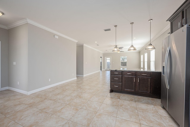 kitchen featuring stainless steel fridge, dark brown cabinets, ceiling fan, and light stone countertops