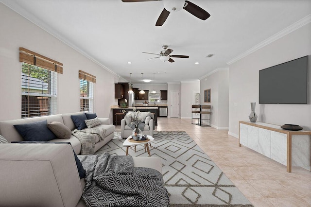 living room featuring light tile patterned floors, ceiling fan, and ornamental molding