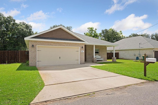 view of front of property featuring a front yard and a garage