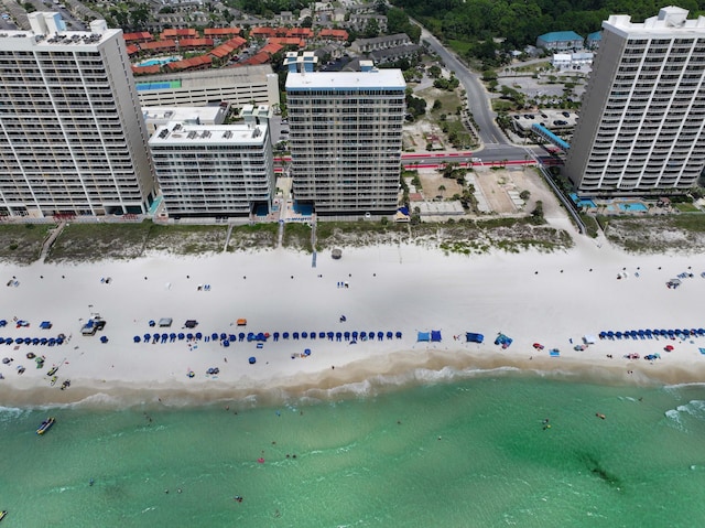 birds eye view of property featuring a water view and a view of the beach