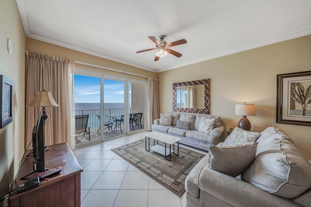 living room with ceiling fan, light tile patterned flooring, and ornamental molding