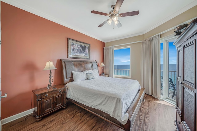 bedroom featuring ceiling fan, crown molding, wood-type flooring, access to outside, and a water view