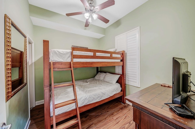 bedroom with ceiling fan and wood-type flooring