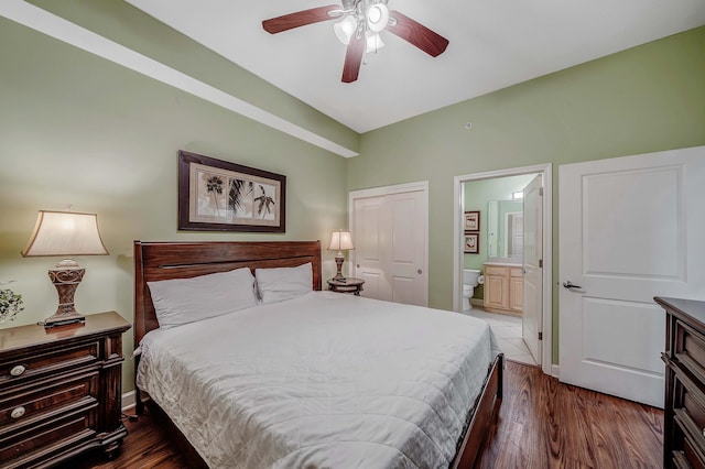 bedroom featuring ceiling fan, dark hardwood / wood-style flooring, ensuite bathroom, and a closet