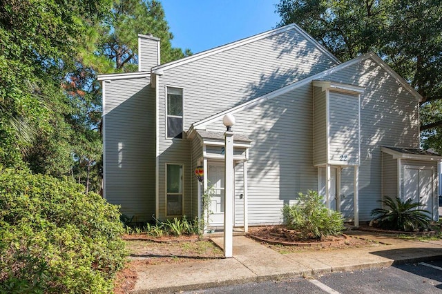 traditional-style home featuring a chimney