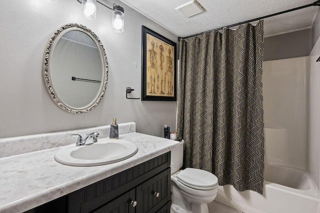 bathroom featuring visible vents, toilet, vanity, shower / bath combination with curtain, and a textured ceiling