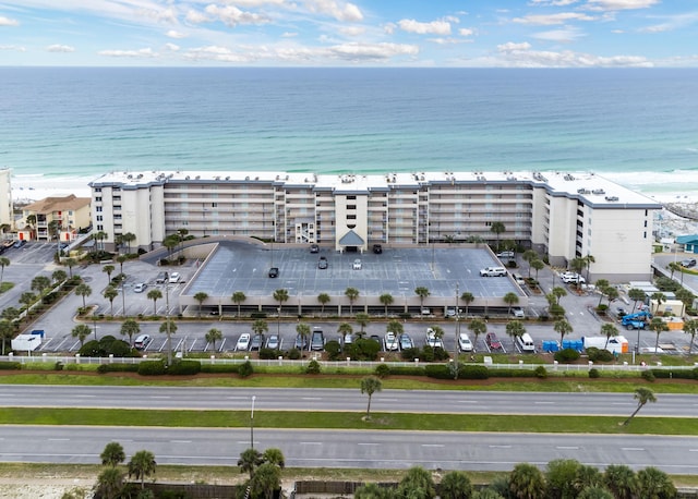 drone / aerial view featuring a water view and a beach view