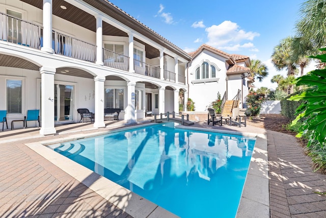 view of swimming pool with a patio area