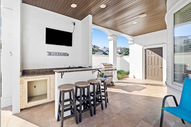 view of patio / terrace featuring exterior bar and grilling area