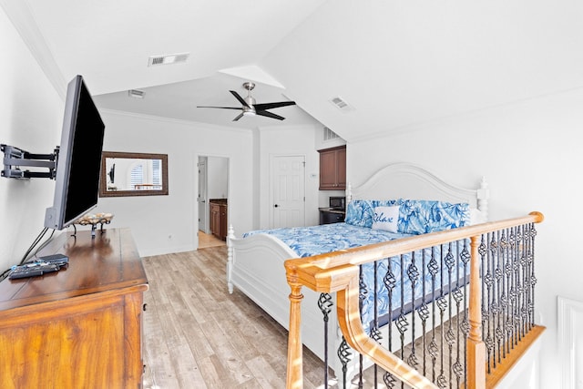 bedroom with lofted ceiling, light wood-type flooring, ceiling fan, and ornamental molding