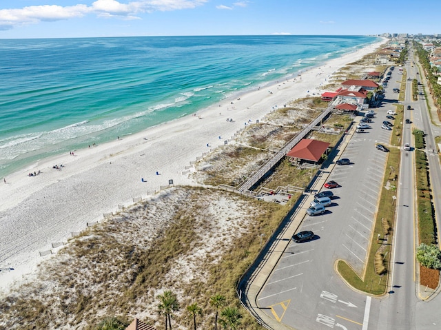 birds eye view of property featuring a view of the beach and a water view