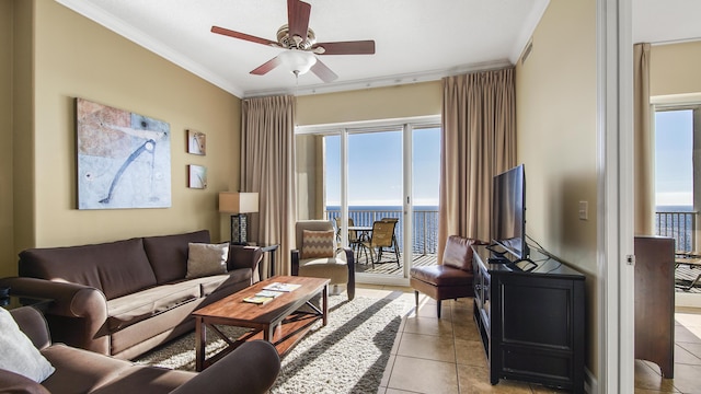 tiled living room with crown molding and ceiling fan