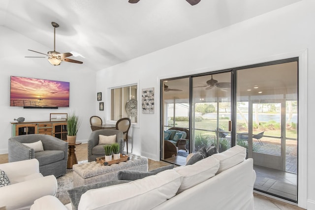 living room featuring vaulted ceiling and light tile patterned flooring