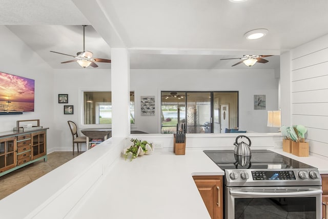 kitchen with electric range and tile patterned flooring