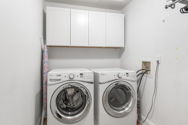 laundry room featuring cabinets and independent washer and dryer