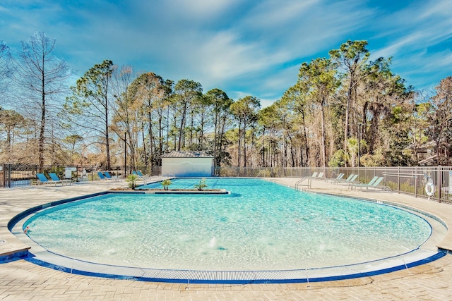 view of swimming pool featuring a patio area