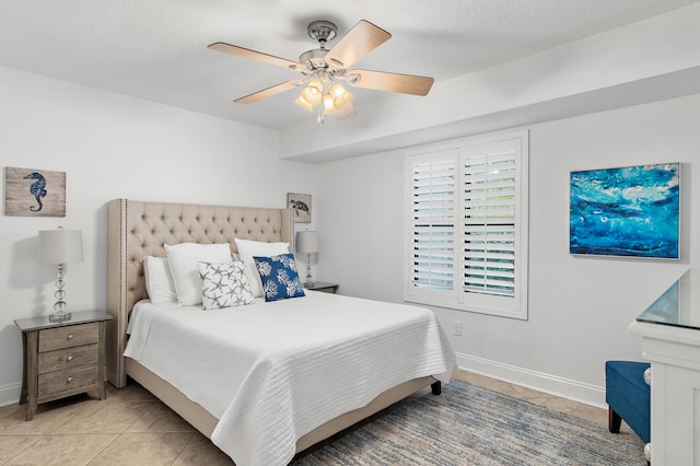 tiled bedroom with ceiling fan