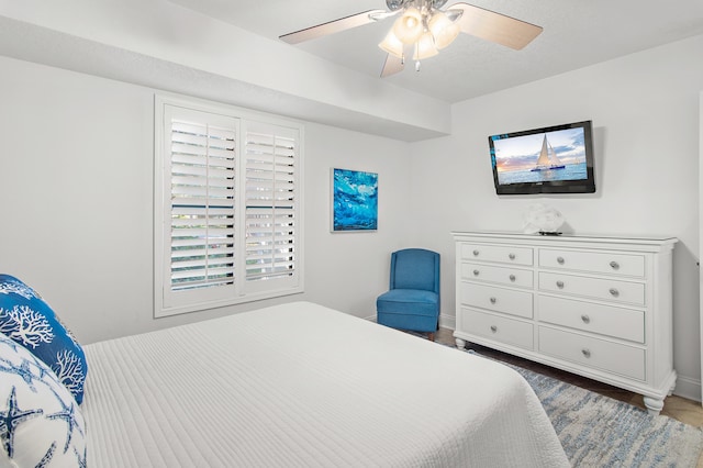 bedroom with hardwood / wood-style floors and ceiling fan