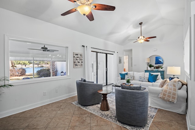 living room with light tile patterned floors and vaulted ceiling