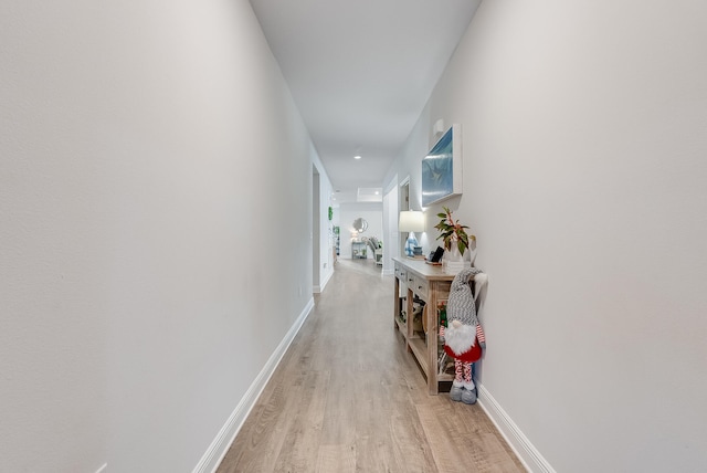 corridor featuring light hardwood / wood-style flooring