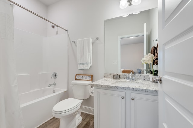 full bathroom with vanity, toilet, wood-type flooring, and bathing tub / shower combination