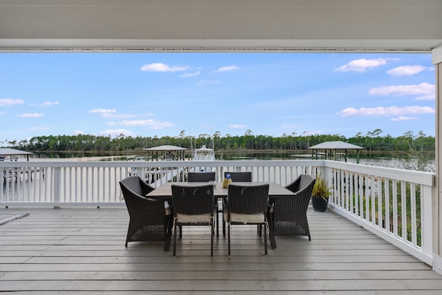 wooden deck featuring a gazebo and a water view