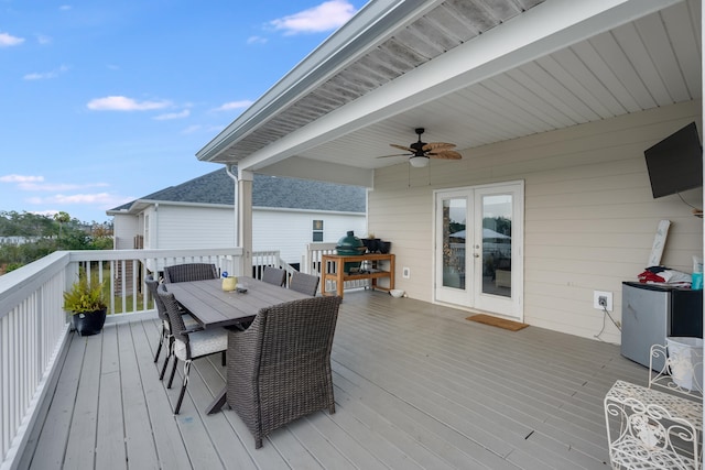 deck with ceiling fan and french doors