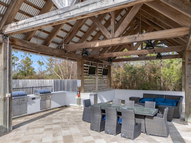 view of patio featuring a gazebo, a grill, and exterior kitchen