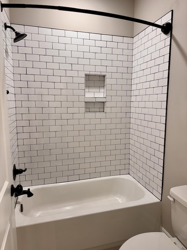 bathroom with shower / bath combination and toilet