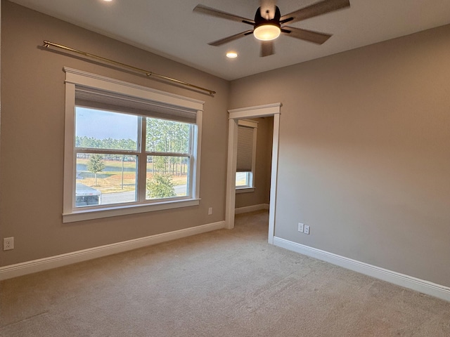 spare room featuring recessed lighting, carpet flooring, ceiling fan, and baseboards