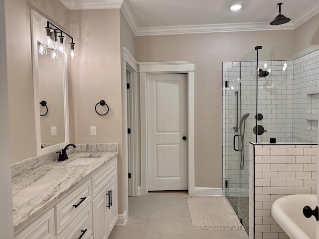 bathroom featuring a stall shower, vanity, ornamental molding, and a soaking tub