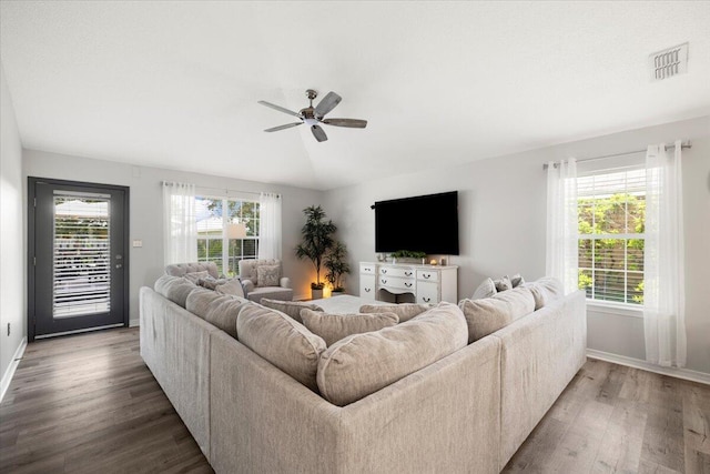 living room with vaulted ceiling, ceiling fan, and dark hardwood / wood-style flooring