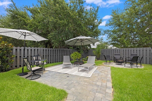 view of patio / terrace with an outdoor fire pit