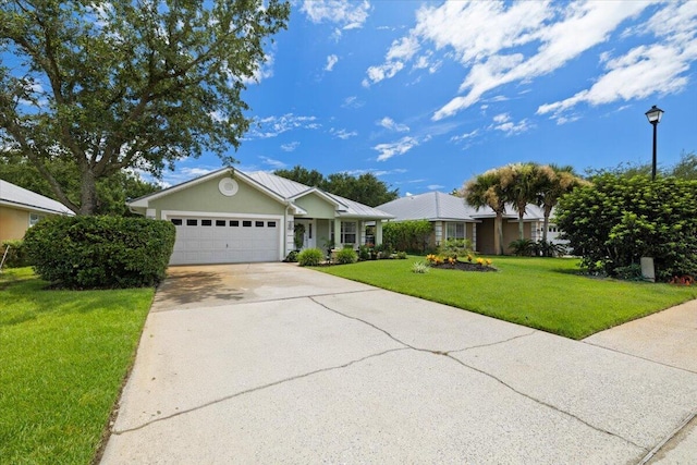 ranch-style home featuring a garage and a front yard