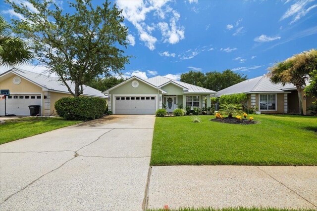 single story home featuring a garage and a front lawn