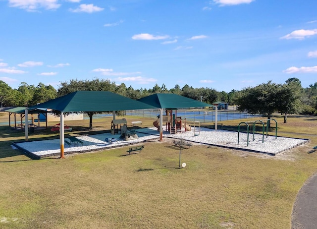 exterior space featuring a gazebo, a playground, and a lawn