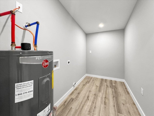 utility room featuring water heater