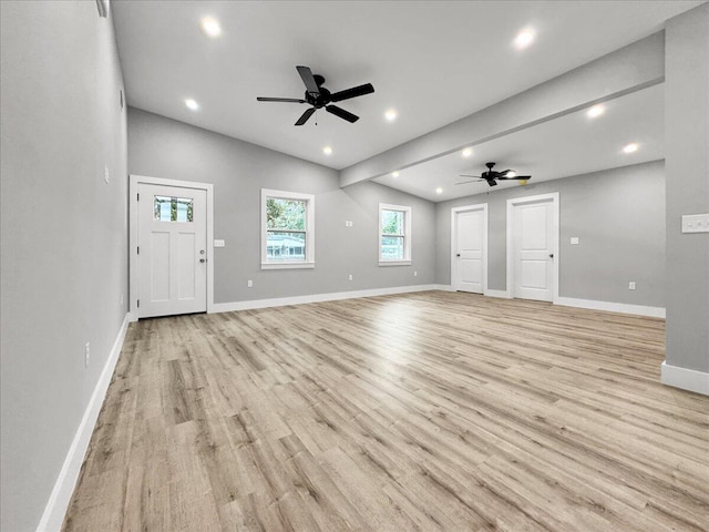 unfurnished living room featuring ceiling fan, lofted ceiling, and light hardwood / wood-style floors